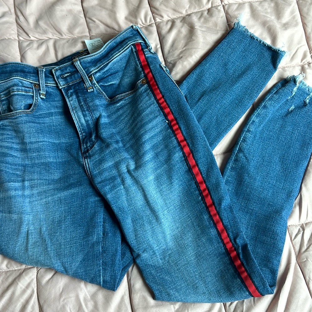 Blue jeans with red stripes